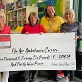 Jane Wood and fellow organisers with a cheque from their fundraising event for the air ambulance