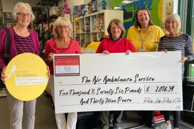 Jane Wood and fellow organisers with a cheque from their fundraising event for the air ambulance