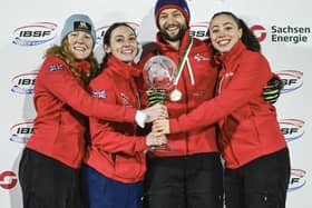 Amelia Coltman, left with the GB Golden Globe winning team in Germany.