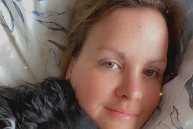 Hayley Short cuddles her beloved dog, Mila
