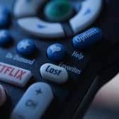 Netflix is launching the sub-account model soon, and a cheaper subscription package next month. Picture: Chris DELMAS/AFP via Getty Images.