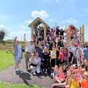 Villagers celebrate the opening of their new playground at Great Dalby