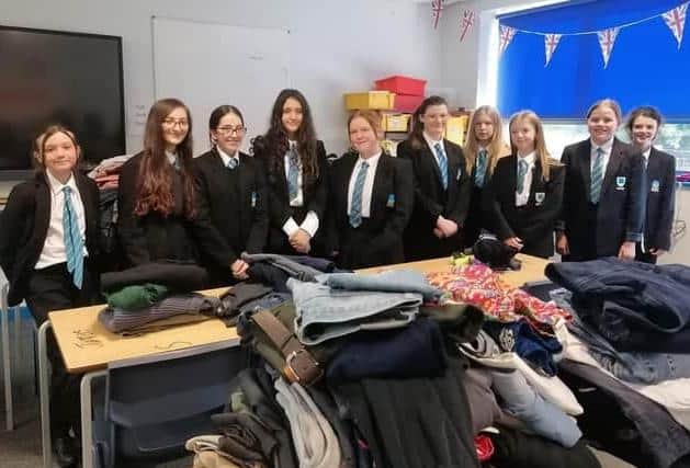 Students at Melton's Long Field Spencer Academy pictured with donating items last year for refugees being housed at a local hotel