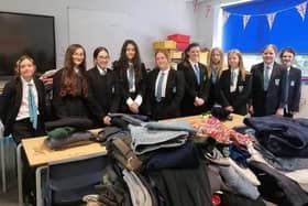Students at Melton's Long Field Spencer Academy pictured with donating items last year for refugees being housed at a local hotel