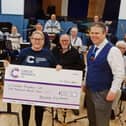 Belvoir Big Band present a cheque to Becky Elphick, of Cancer Research UK