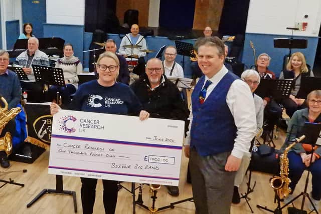 Belvoir Big Band present a cheque to Becky Elphick, of Cancer Research UK