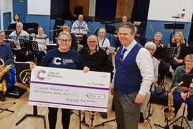 Belvoir Big Band present a cheque to Becky Elphick, of Cancer Research UK