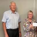 President Gordon Wells (right) and fellow Rotary member Derek Simmonds present cheque for £10,000 to Janet Gilchrist, secretary of the
local Macmillan group, from the proceeds of a concert by Grimethorpe Colliery Band