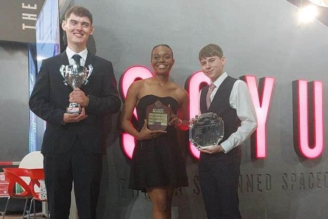 Sharon, Ben, and Dom celebrate with their awards