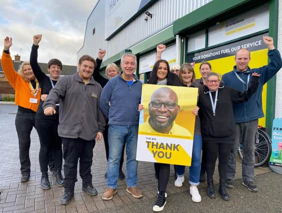 Staff and volunteers at The Hanger charity superstore in Melton Mowbray celebrate funding 1,000 lifesaving missions for the local air ambulance service