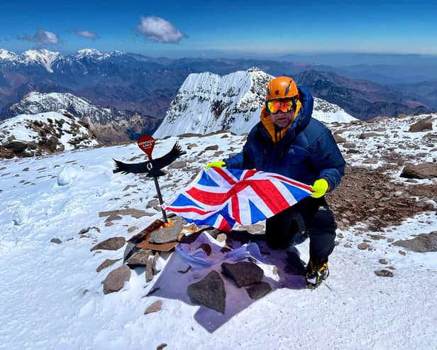 Chris Foster at the summit of Mount Aconcagua in Argentina
