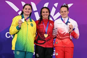 Silver medallist Australia's Iona Alexandra Anderson (L), gold medallist Canada's Kylie Masse (C) and bronze medallist England's Lauren Cox celebrate during the Women's 50m Backstroke Medal Ceremony at the swimming event at the Tollcross International Swimming Centre in Glasgow, on day five of the Commonwealth Games in Glasgow, Scotland, on July 28, 2026. (Photo by Oli SCARFF / AFP via Getty Images)