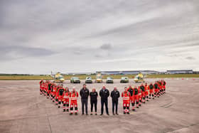 Crew members with the Derbyshire, Leicestershire & Rutland Air Ambulance (DLRAA)