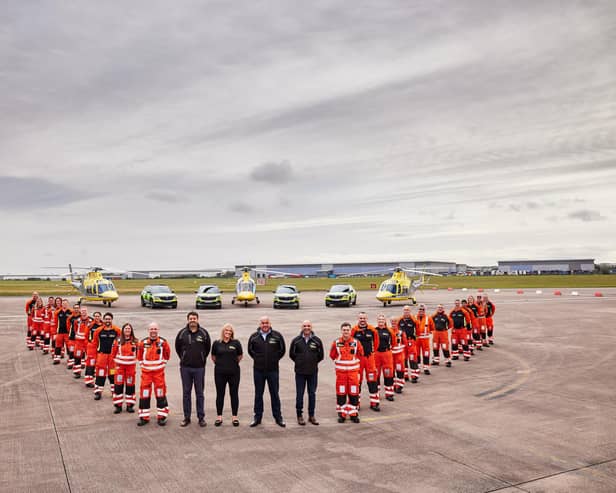 Crew members with the Derbyshire, Leicestershire & Rutland Air Ambulance (DLRAA)