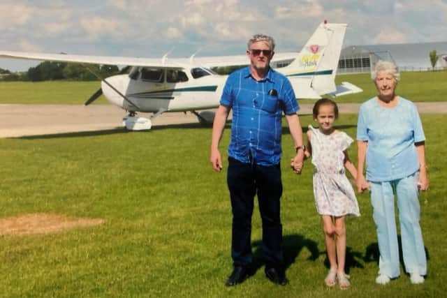 Kathleen Bishop with family members as she flew in a plane on her 95th birthday