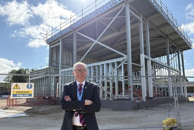 Long Field Spencer Academy principal Chris Haggett in front of the new building under construction