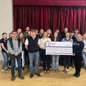 Members of Melton young farmers hand over a cheque to Cancer Research UK
