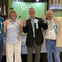 Andrew Innes (second from right) celebrates with Reform UK supporters after winning Melton East