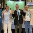 Andrew Innes (second from right) celebrates with Reform UK supporters after winning Melton East