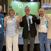 Andrew Innes (second from right) celebrates with Reform UK supporters after winning Melton East