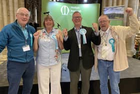 Andrew Innes (second from right) celebrates with Reform UK supporters after winning Melton East