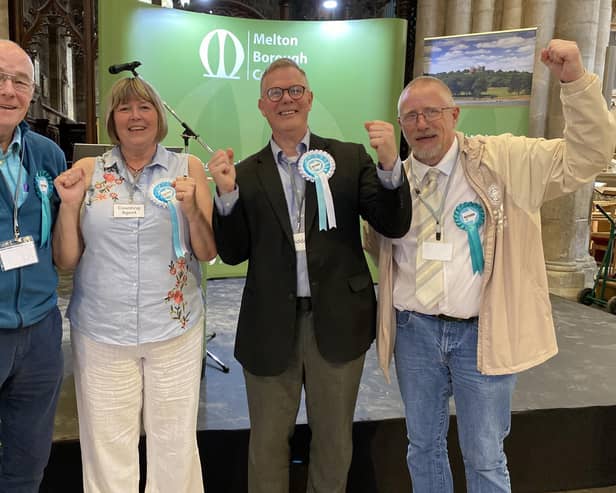 Andrew Innes (second from right) celebrates with Reform UK supporters after winning Melton East