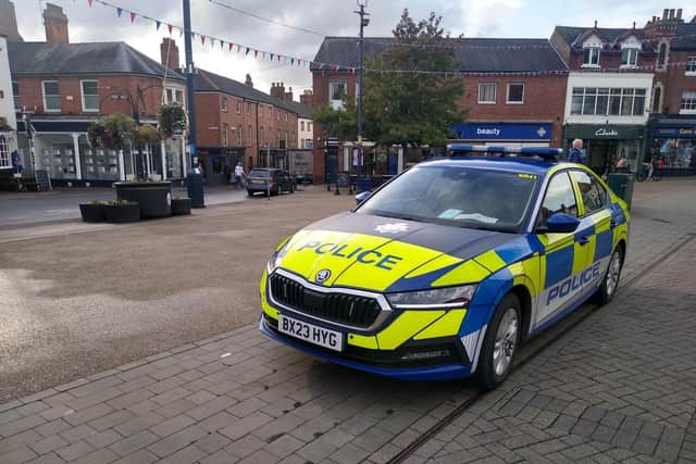 A police car in Melton's Market Place as officers continue to enforce the new dispersal orders this evening