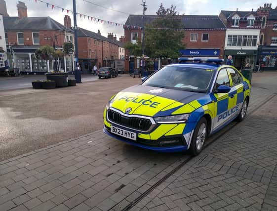 A police car in Melton's Market Place as officers continue to enforce the new dispersal orders this evening
