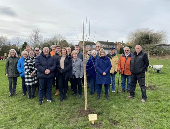 Friends of Melton Country Park members and borough councillors with one of the trees in memory of Bill and Jean Forbes