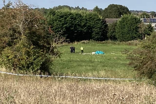 Police officers at the glider crash site close to the A607 Leicester Road in Melton this afternoon
