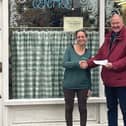 David Alcraft, Lodge Charity Steward for the Melton and Oakham Freemasons, presents a cheque to Jenny Hendry, Melton centre manager for Pepper's - A Safe Place