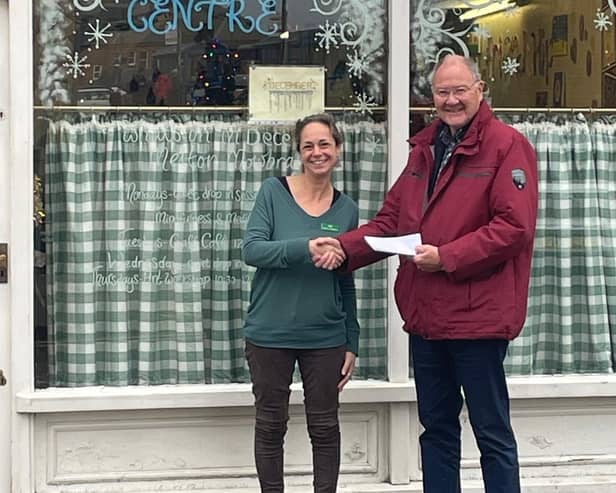 David Alcraft, Lodge Charity Steward for the Melton and Oakham Freemasons, presents a cheque to Jenny Hendry, Melton centre manager for Pepper's - A Safe Place