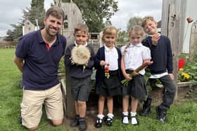 Some of the Swallowdale Primary School children who enjoy their gardening activities with teacher Dan Corcoran