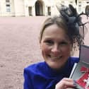Claire Lomas with her MBE after being presented with it by Prince William in 2017