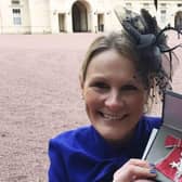 Claire Lomas with her MBE after being presented with it by Prince William in 2017