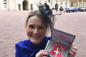 Claire Lomas with her MBE after being presented with it by Prince William in 2017