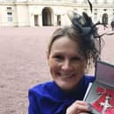 Claire Lomas with her MBE after being presented with it by Prince William in 2017