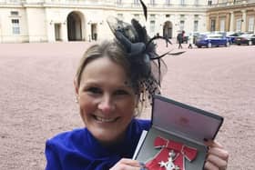 Claire Lomas with her MBE after being presented with it by Prince William in 2017