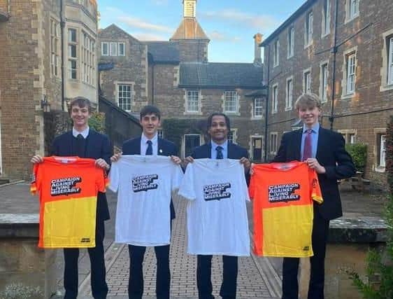 Jono Hedley (left) with fellow Oakham School students promoting the charity he is supporting