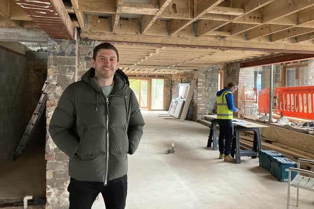Harry Gurney pictured this week in the bar area as the rebuild job continues at the Tap and Run pub