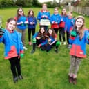 Wymeswold Girl Guides show off the gardening equipment gifted by housebuilders, Dandara