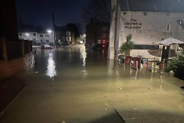 Floodwaters outside the Crown and Plough pub at Long Clawson yesterday