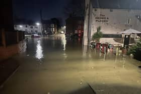 Floodwaters outside the Crown and Plough pub at Long Clawson yesterday