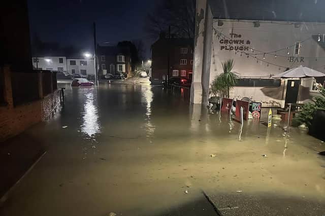 Floodwaters outside the Crown and Plough pub at Long Clawson yesterday