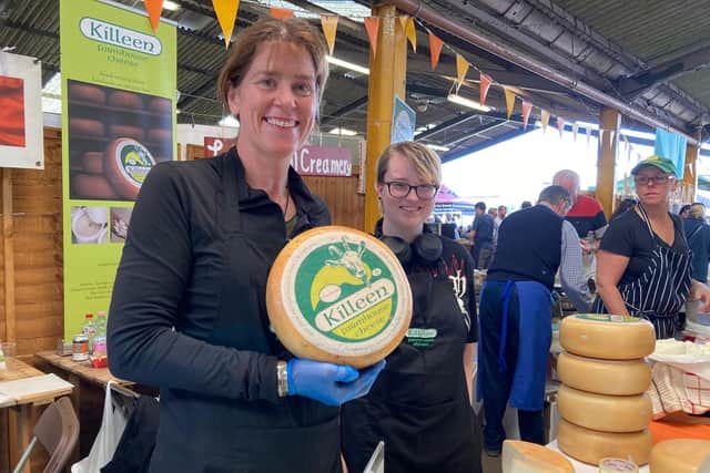 Marion Roeleveld shows off products on the Killeen Farmhouse Cheese stand at the Artisan Cheese Fair