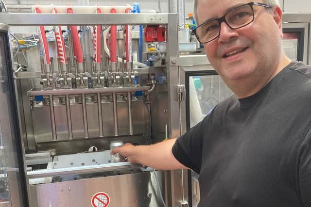Head brewer Colin Paige on the canning line at Round Corner Brewing