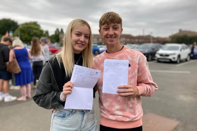 James Aldridge and Hollie Hough show off their GCSE results at Long Field
