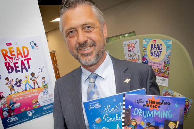County councillor Kevin Crook is encouraging children to get involved in this year's Summer Reading Challenge