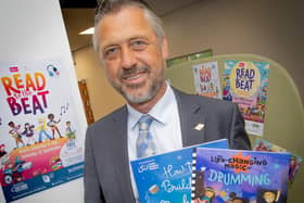 County councillor Kevin Crook is encouraging children to get involved in this year's Summer Reading Challenge