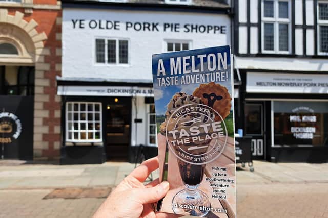 The new 'Taste Adventure' foodie guide pictured outside Melton's Ye Olde Pork Pie Shoppe